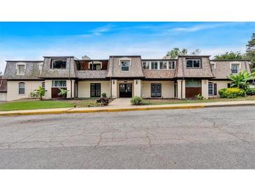 Classic-style home featuring well-maintained landscaping, dormer windows, and a welcoming entryway at 122 Rue Fontaine, Lithonia, GA 30038