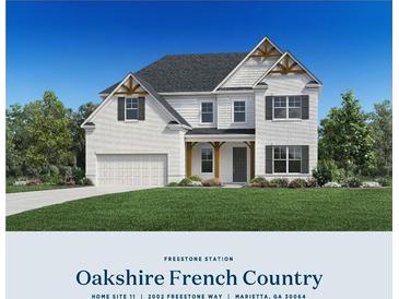 Charming two-story home with a brick and siding exterior, attached garage, and well-manicured lawn at 2002 Freestone Way, Marietta, GA 30064