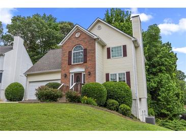 Charming two-story home featuring a well-manicured lawn and inviting front entrance at 4305 Chesapeake Trce, Acworth, GA 30101
