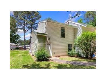 Charming two-story home with lush landscaping and a well-maintained lawn in a serene neighborhood at 4406 Idlewood Ln, Tucker, GA 30084