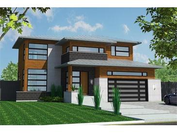 Modern two-story home with wood and white brick exterior and a sleek, contemporary design at 21 Elm St, Hampton, GA 30228