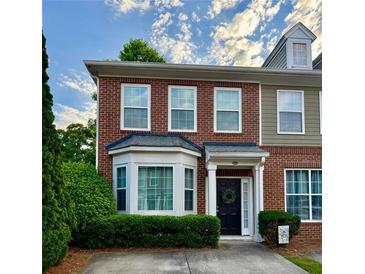 Charming brick townhouse with a well-maintained front yard and inviting entrance at 2167 Del Lago Cir # 11, Kennesaw, GA 30152