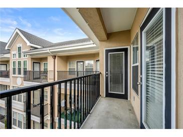 View from balcony with black railings and multi-story condo building at 1850 Cotillion Dr # 4419, Atlanta, GA 30338