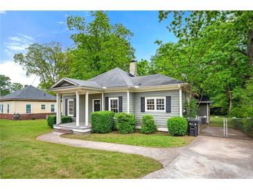 Charming single-story home with a welcoming front porch and manicured landscaping at 3288 Dogwood St, Atlanta, GA 30337