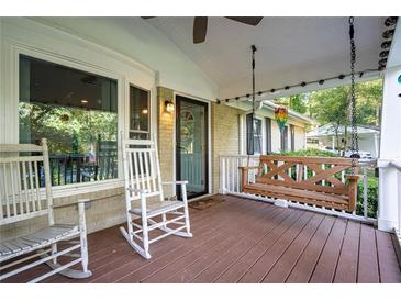 Inviting front porch with rocking chairs and a porch swing, perfect for relaxing outdoors at 118 Lucia Dr, Smyrna, GA 30082