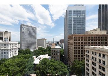 An urban view of the surrounding high-rise buildings shows the bustling city environment with a partly cloudy sky at 57 Forsyth Nw St # 11G, Atlanta, GA 30303