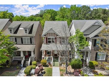 Charming two-story home with manicured front yard and inviting curb appeal in a desirable neighborhood at 1744 Habershal Nw Rd, Atlanta, GA 30318