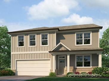 Charming two-story home with beige siding, neutral trim, an attached garage, and a well manicured front yard at 48 Hampton Ter, Dallas, GA 30157