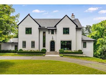 Stunning two-story home with a manicured lawn and lush landscaping at 3773 Randall Se Rd, Atlanta, GA 30339