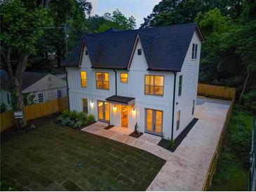 Beautiful two-story home with a manicured lawn, modern design and ample natural light shining through the windows at 2809 Glenwood Se Ave, Atlanta, GA 30317