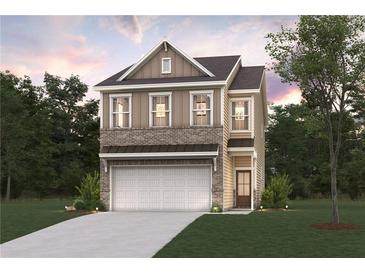 Charming two-story home with brick and siding, features a two-car garage, and a well-manicured lawn at 1886 Copelyn Reese Court (Lot 165), Lawrenceville, GA 30043