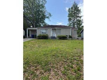 Charming one-story home with lawn and neutral siding at 888 Beecher Sw Ct, Atlanta, GA 30311