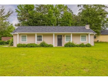 Charming single-story home featuring a well-manicured lawn and neutral exterior paint at 225 Fireside Way, Fairburn, GA 30213
