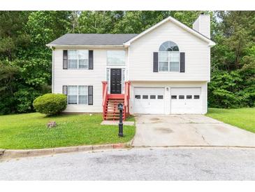 Charming two-story home with a well-manicured lawn and inviting curb appeal at 2240 Creekside Vw, Decatur, GA 30035
