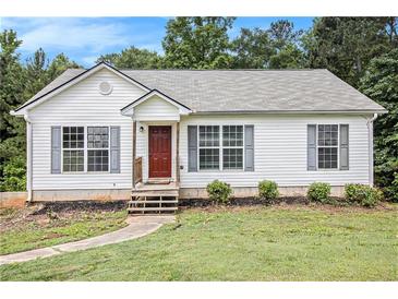 Charming single-story home featuring a well-maintained lawn, neutral siding, and a cozy front porch at 1104 Driftwood Ct, Mcdonough, GA 30252