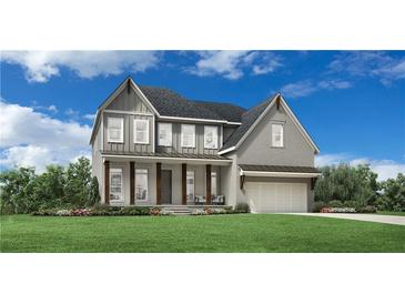 Charming two-story home with gray siding, large front porch, and well-manicured lawn at 7470 Trotting Trl, Cumming, GA 30040