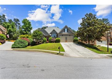 Charming single Gathering home featuring a 2-car garage, landscaped yard, and beautiful lawn at 4251 Lantern Hill Dr, Dacula, GA 30019
