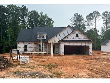 New home under construction with a large garage, set on a wooded lot at 610 Presley Farm Pkwy, Rockmart, GA 30153