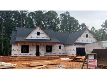 New construction home featuring a charming design with a covered front porch and a classic roofline at 620 Presley Farm Parkway Dr, Rockmart, GA 30153