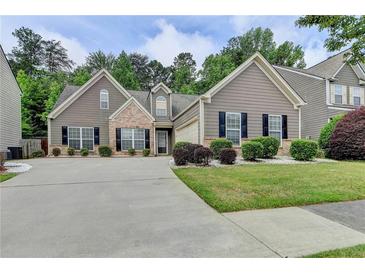 Charming two-story home with landscaped yard and welcoming curb appeal, complemented by a well-maintained driveway at 2842 Sedgeview Ln, Buford, GA 30519
