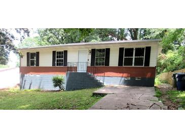 Charming single-story home featuring a brick foundation and well-maintained front yard at 3086 Lone Oak Sw Ave, Atlanta, GA 30354