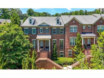 Charming red brick townhouse with manicured landscaping and traditional architectural details at 2828 Broughton Se Ln, Atlanta, GA 30339