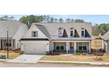 Charming single-Gathering home featuring a symmetrical facade, inviting front porch, and well-manicured front yard at 3772 Tielman St, Snellville, GA 30078