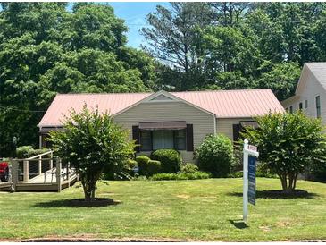 Charming single-story home with a well-maintained front yard and inviting curb appeal at 437 Eastland Dr, Decatur, GA 30030