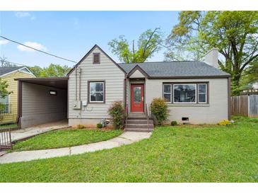 Charming bungalow-style home featuring a cozy front yard and a convenient carport at 664 Florence Nw Pl, Atlanta, GA 30318