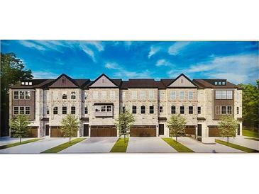 Brick townhomes with attached garages feature a classic architectural style and manicured landscaping at 1161 Dahlonega Hwy # 9, Cumming, GA 30040