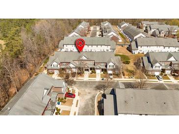 Aerial view of townhomes with brick and siding exteriors, garages, and well-maintained landscaping at 2555 Flat Shoals Road Rd # 1104, College Park, GA 30349