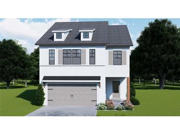 Charming two-story home featuring white brick, a gray roof, and a two-car garage at 4524 Eastbrook Pl, Snellville, GA 30039