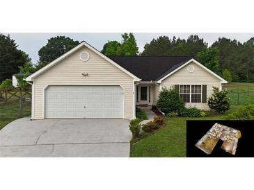 Charming single-story home featuring a two-car garage and well-maintained landscaping at 210 Overview Ct, Villa Rica, GA 30180