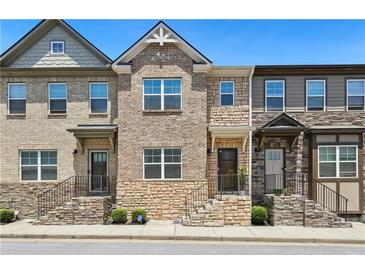 Attractive townhome exteriors with stone accents and welcoming front entrances at 178 Munira Sw Ln, Atlanta, GA 30331