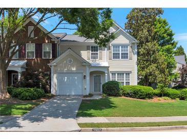Charming two-story home with a well-manicured lawn and attached one car garage at 2907 Timbercreek Cir, Roswell, GA 30076