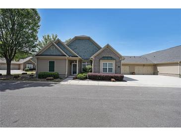 Inviting one-story home with brick and siding, complemented by a manicured lawn and charming curb appeal at 223 Glens Loop, Woodstock, GA 30188