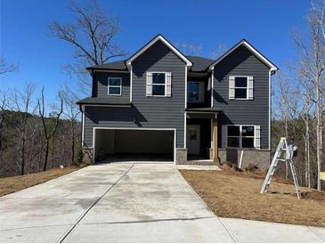 Charming two-story home with attached garage and new concrete driveway at 5518 Legacy Trl, Douglasville, GA 30135