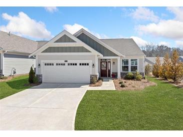 Charming home with a well-manicured lawn, two-car garage, and inviting front entrance at 41 Balsam Dr, Dallas, GA 30157