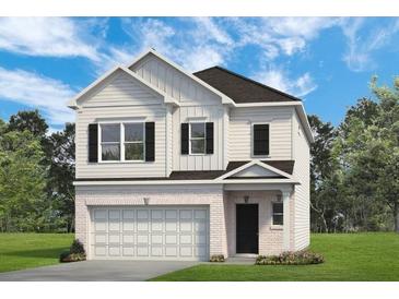 Charming two-story home with white siding, black shutters, and a convenient attached two-car garage at 1125 Elowen Dr, Austell, GA 30168