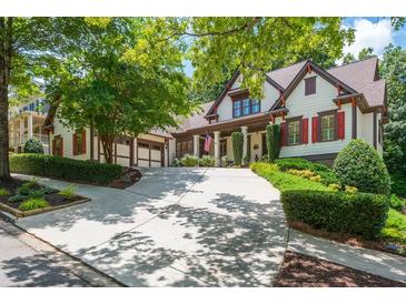 Charming home with a manicured lawn, inviting driveway and a two-car garage at 9967 Devonshire St, Douglasville, GA 30135