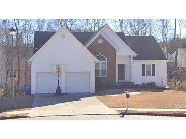 Charming single-Gathering home with a two-car garage, well-maintained lawn, and traditional design elements at 2504 Dalesford Ct, Dacula, GA 30019
