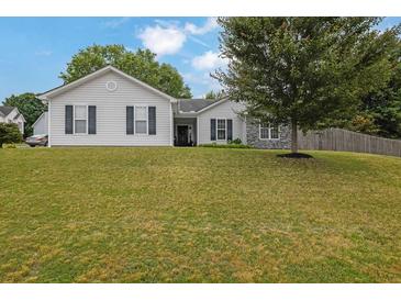 Charming single-story home with light siding, dark shutters, and a well-manicured lawn at 507 Hillcrest Cross Rd, Canton, GA 30115