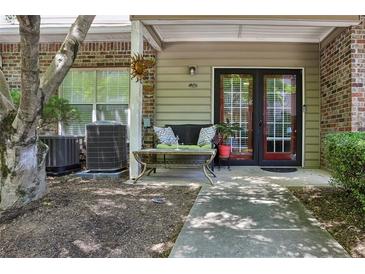 Charming front porch with seating and double doors at 2700 Pine Tree Rd # 3006, Atlanta, GA 30324