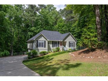 Charming single-Gathering home with manicured lawn and mature trees, offering a peaceful setting at 1737 Mount Berry Dr, Douglasville, GA 30135