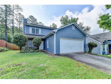 Charming two-story home with a well-manicured lawn and a two car garage in a desirable neighborhood at 200 Mona Ct, Lawrenceville, GA 30044