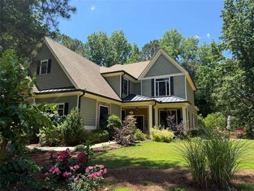 Charming home exterior with lush landscaping, manicured lawn, and inviting curb appeal at 1323 Frey Lake Ct, Kennesaw, GA 30144