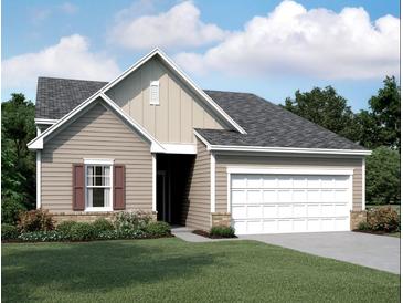 Charming single-story home featuring a two-car garage, siding, and manicured lawn at 41 Bandimere Parkway, Dallas, GA 30157