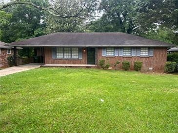 Charming one-story brick home with blue shutters and a well-maintained front yard at 2261 Star Mist Sw Dr, Atlanta, GA 30311