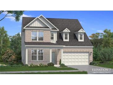 Charming two-story home with brick and gray siding, complemented by a well-manicured lawn at 2505 Dixon Pl, Lawrenceville, GA 30045