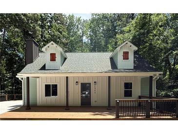 Charming home features a front porch, dormer windows and a new roof at 5345 Pilgrim Point Rd, Cumming, GA 30041